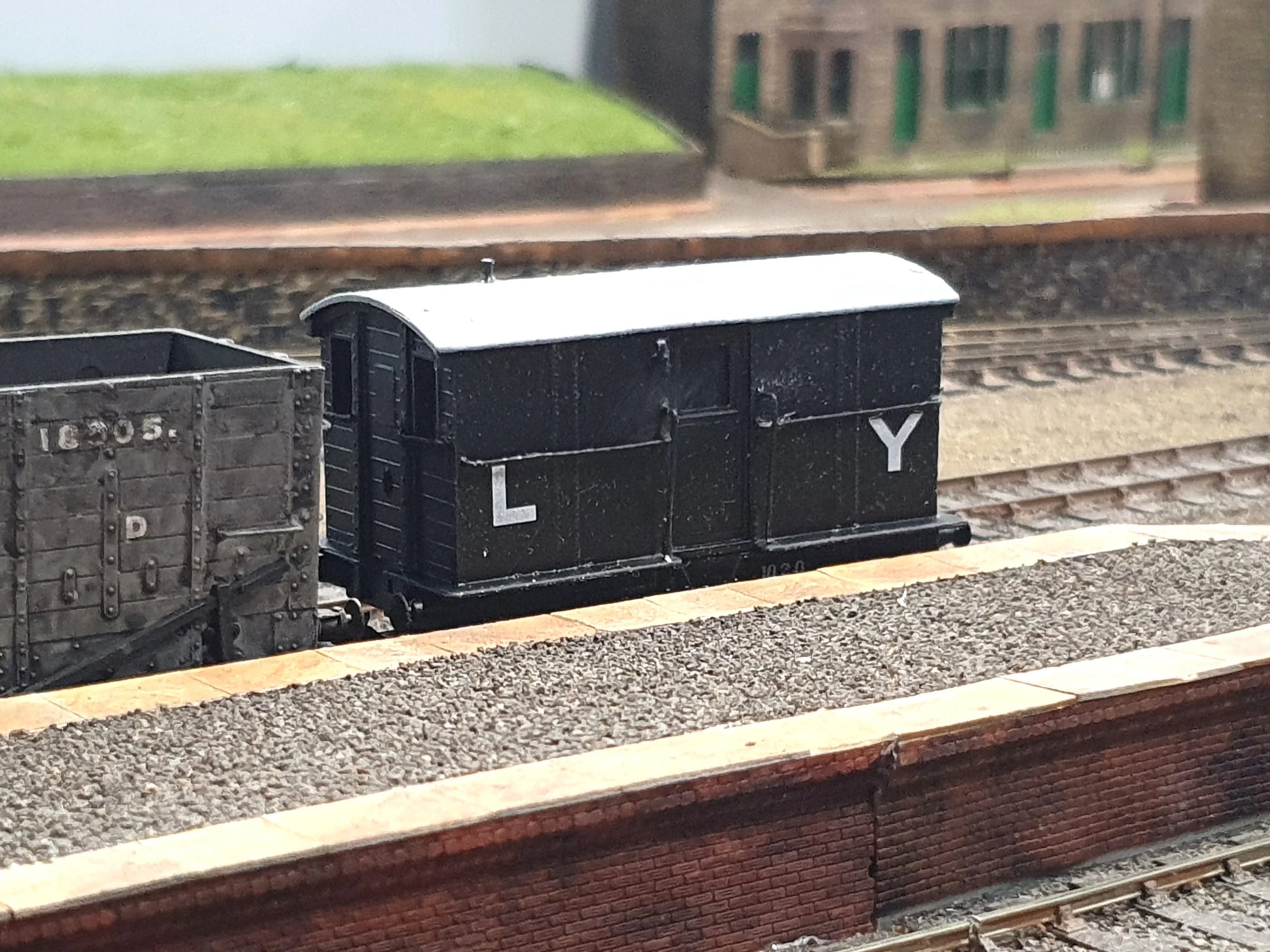 Example of a decorated OO/EM model of an L&Y "Tin Tab" brake van on a layout