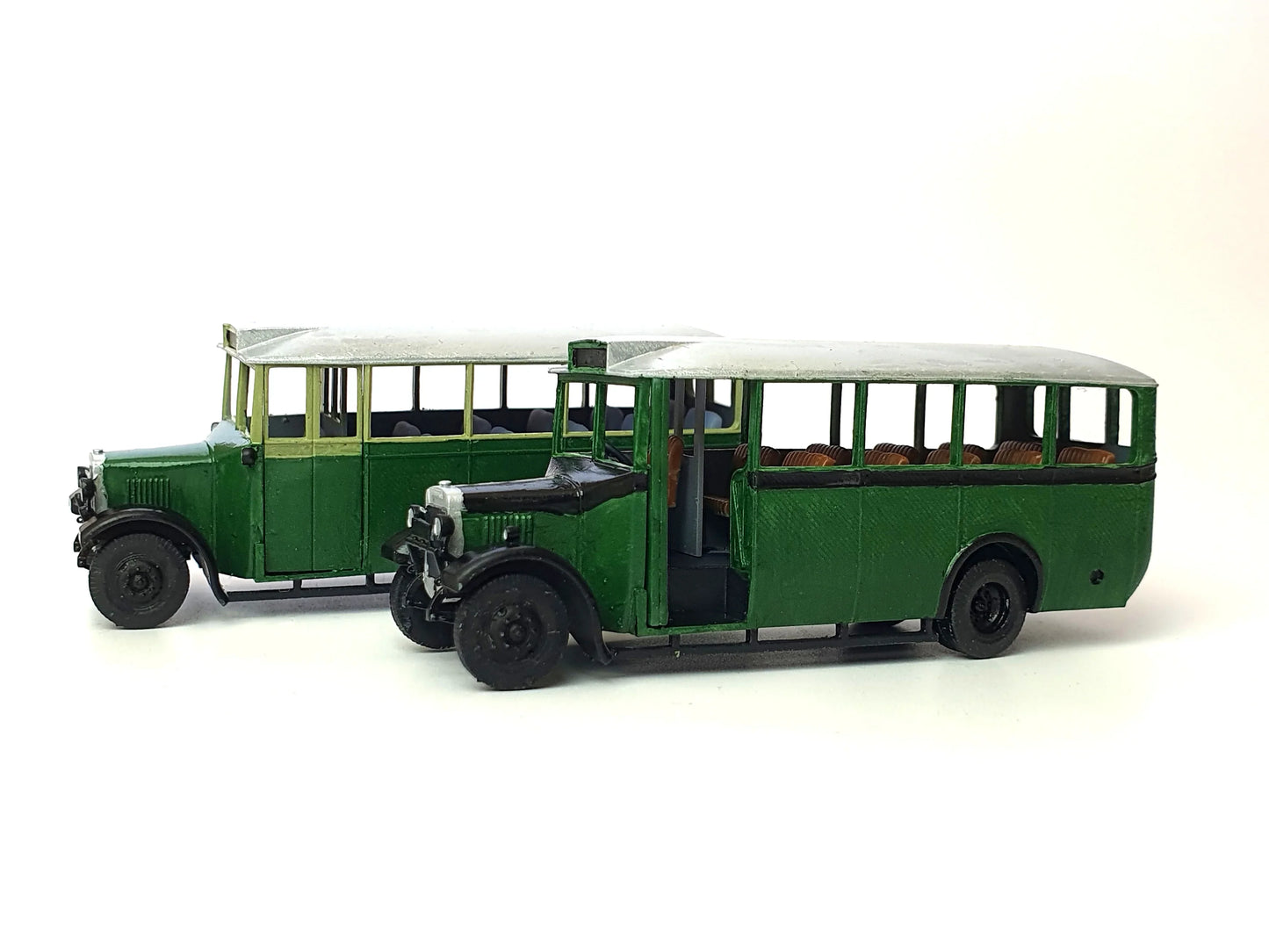 Side view of painted examples of the General and London transport versions of our scale model 20-seat Thornycroft bus - Three Peaks Models