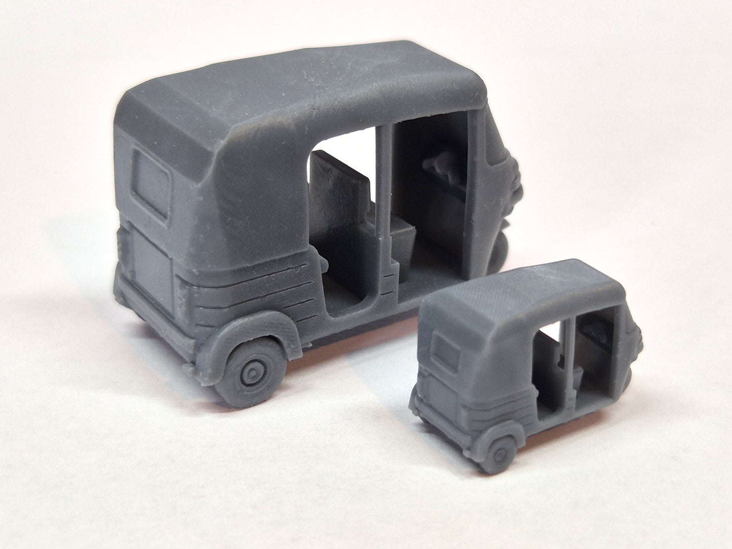 Two scale model tuk tuks viewed from the back - Three Peaks Models