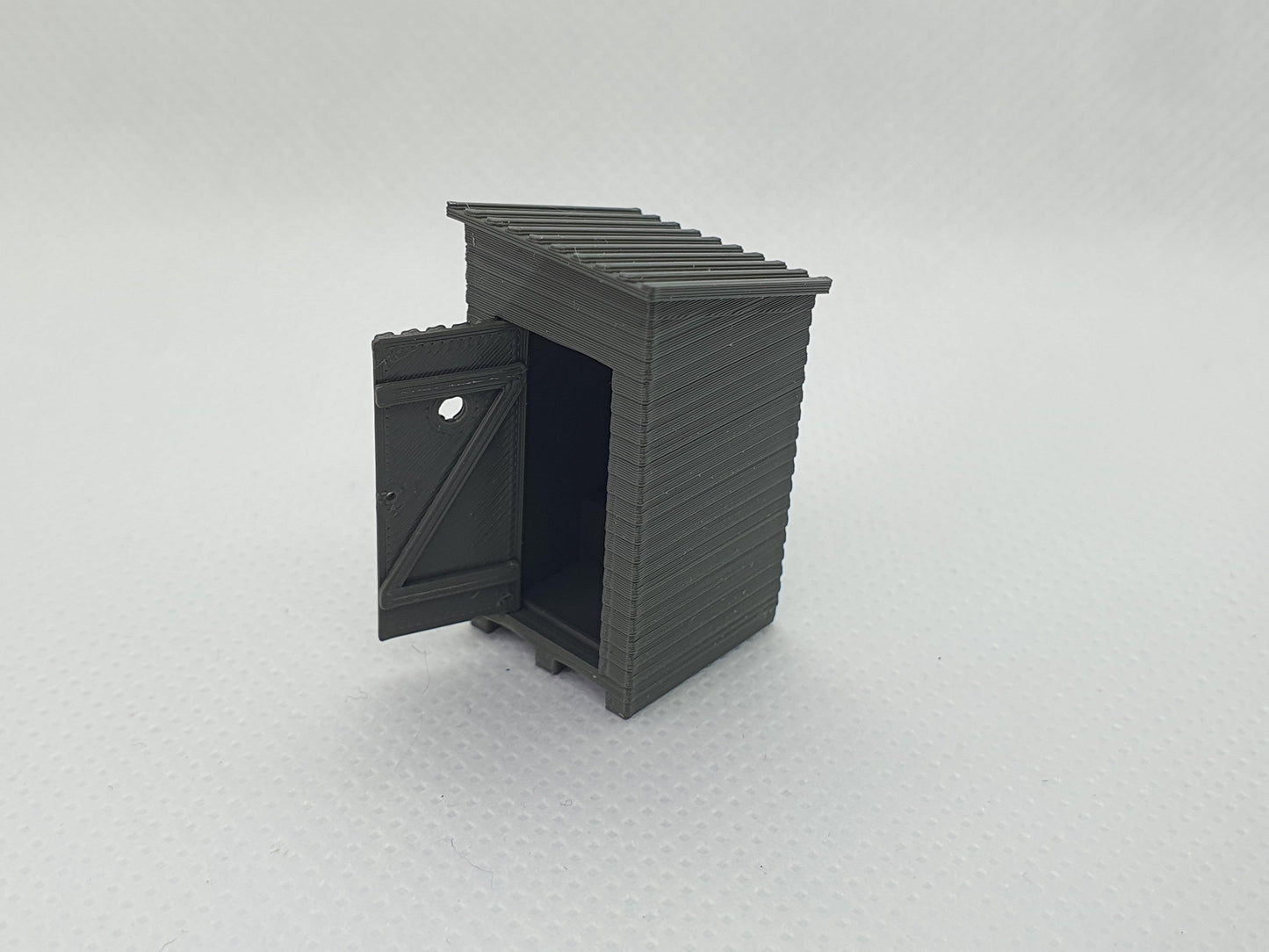 OO gauge scale model of an outside toilet with the door open - Three Peaks Models