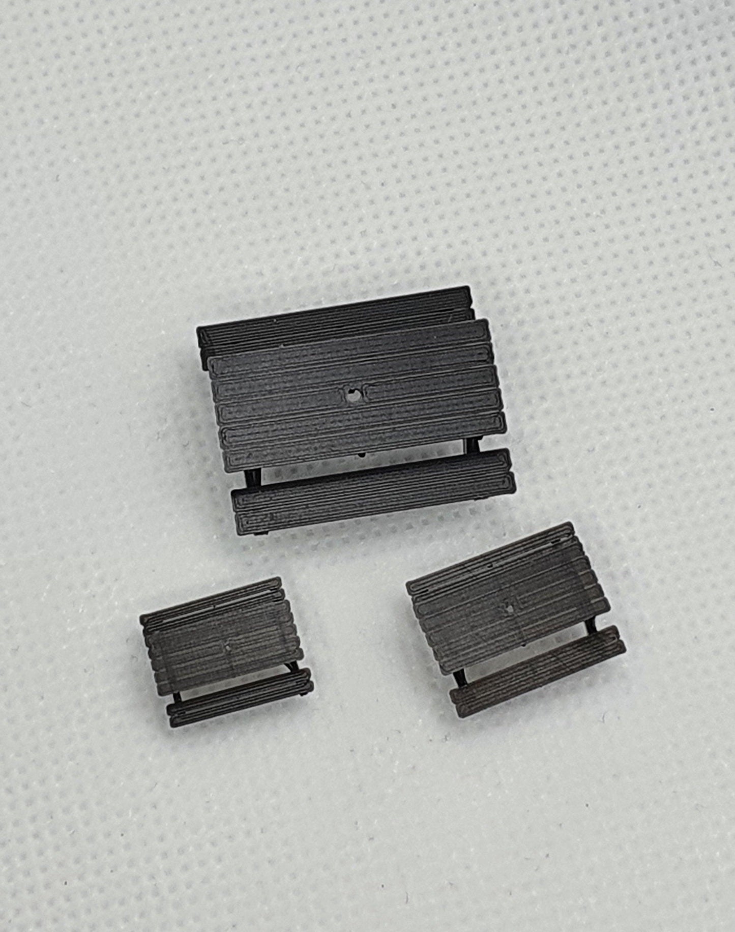 Top view of 3 scale model picnic benches, one in OO, one in TT and one in N gauge - Three Peaks Models