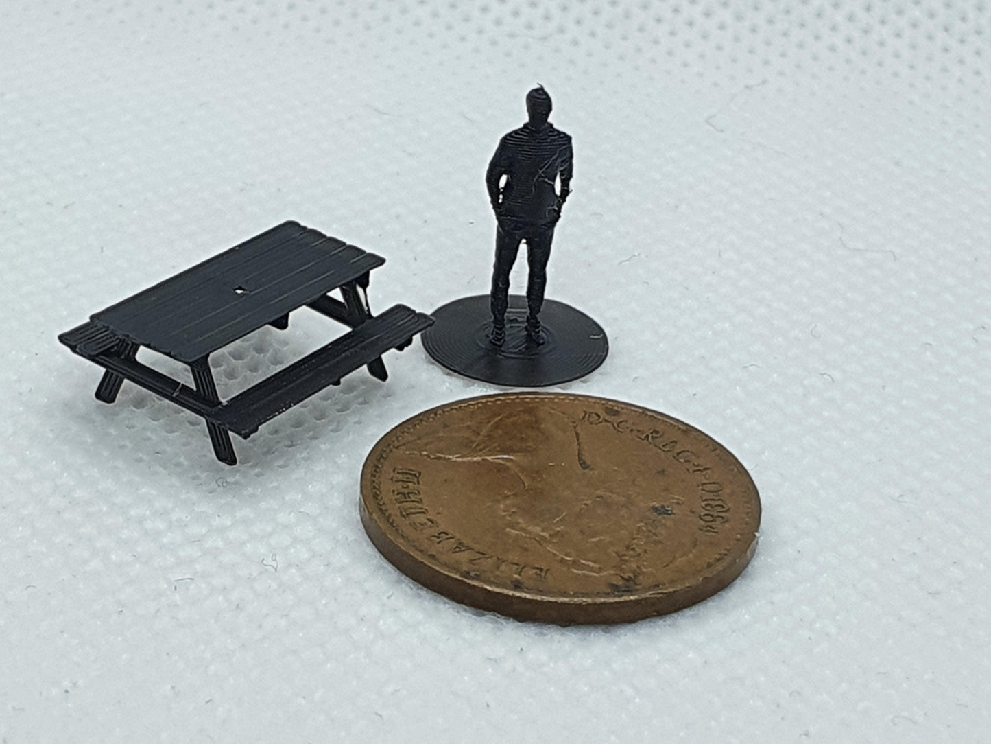 TT gauge scale model picnic bench with TT figure and a penny for scale - Three Peaks Models