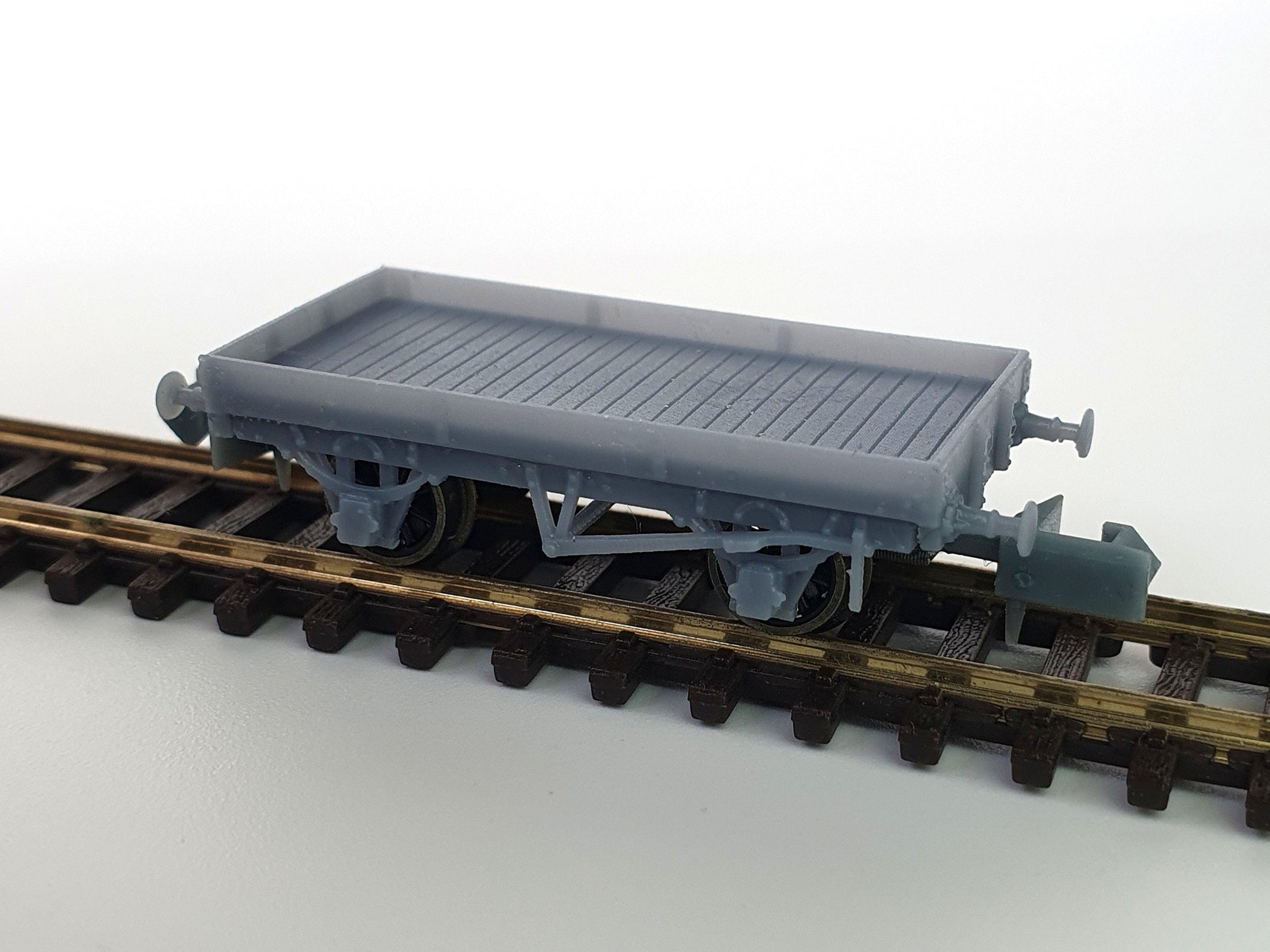 N (1:148) scale model of an L&Y Diagram 1 Low Goods wagon placed on track, with standard couplers attached - Three Peaks Models