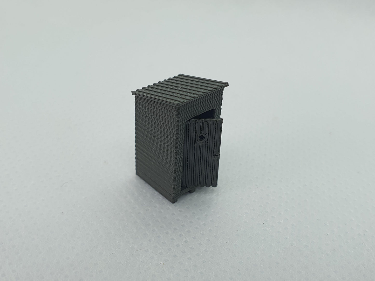 TT gauge scale model of an outside toilet with the door partially open - Three Peaks Models