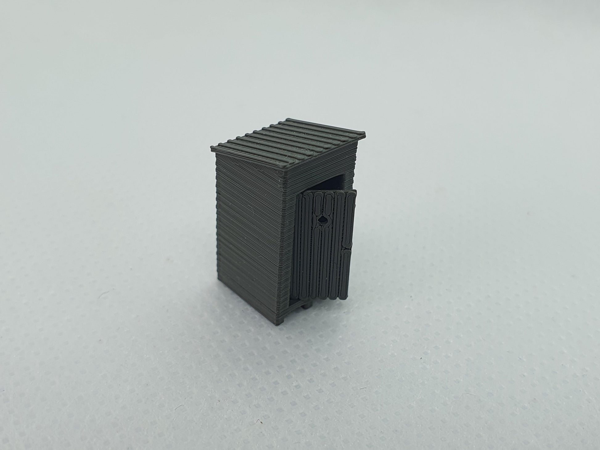 TT gauge scale model of an outside toilet with the door partially open - Three Peaks Models